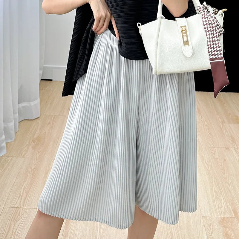 Miyake pleated casual mid-pants women 2023 new summer solid color loose large size drape high waist five-point shorts sweatpants